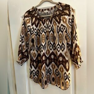 Chicos tunic top. White background with browns & tans. Chico size one.
